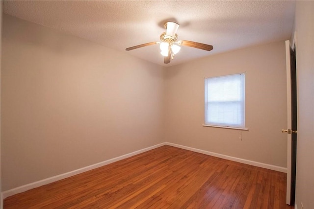 unfurnished room featuring a textured ceiling, ceiling fan, and wood-type flooring