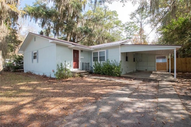 single story home with a carport