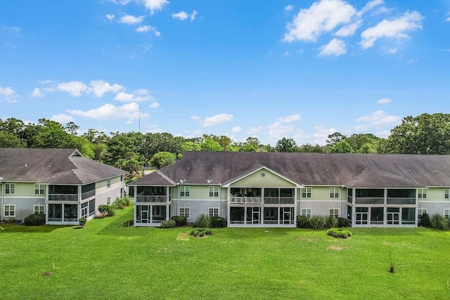 7272 Shellman Bluff Rd NE Unit 17, Townsend, GA 31331 - rear view of house featuring a sunroom and a yard