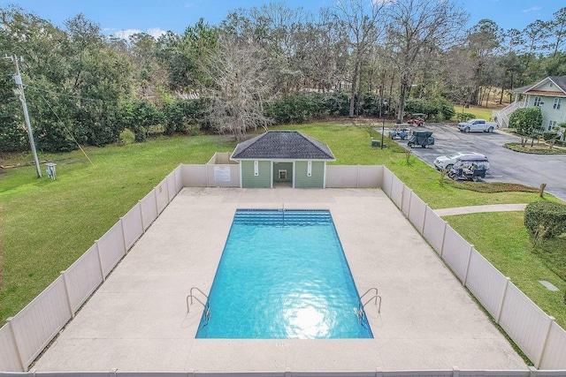 7272 Shellman Bluff Rd NE Unit 17, Townsend, GA 31331 - view of pool with a fenced backyard, an outbuilding, view of wooded area, and a patio