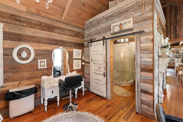 510 Bladen Rd, Brunswick, GA 31523 - home office with wood walls, a barn door, and wood finished floors