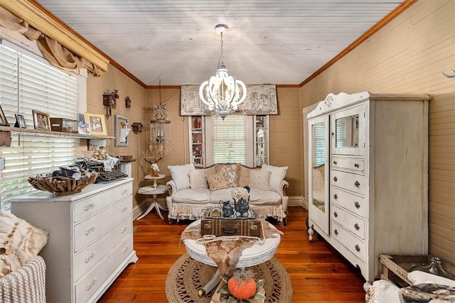 510 Bladen Rd, Brunswick, GA 31523 - living room with crown molding, wooden walls, a chandelier, and hardwood / wood-style flooring