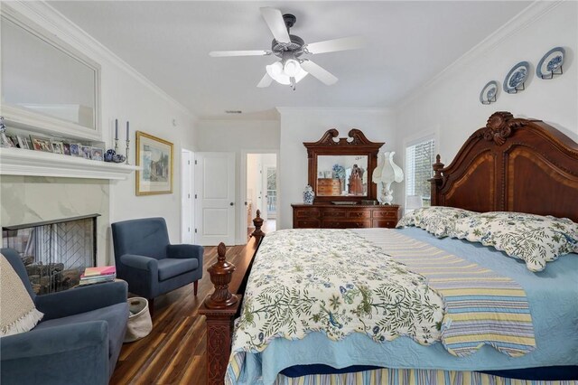 1068 Picnic Ln NE, Townsend, GA 31331 - bedroom with a fireplace, wood finished floors, a ceiling fan, and ornamental molding