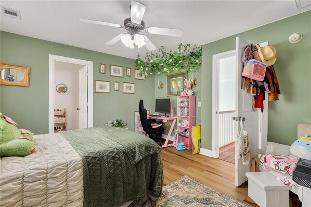 1068 Picnic Ln NE, Townsend, GA 31331 - bedroom with baseboards, light wood-style flooring, visible vents, and ceiling fan