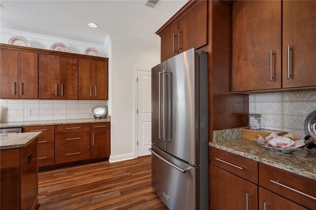 1068 Picnic Ln NE, Townsend, GA 31331 - kitchen with dark wood-style floors, high quality fridge, backsplash, light stone countertops, and visible vents