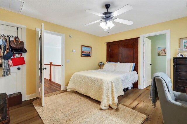 1068 Picnic Ln NE, Townsend, GA 31331 - bedroom featuring baseboards, hardwood / wood-style flooring, visible vents, and ceiling fan