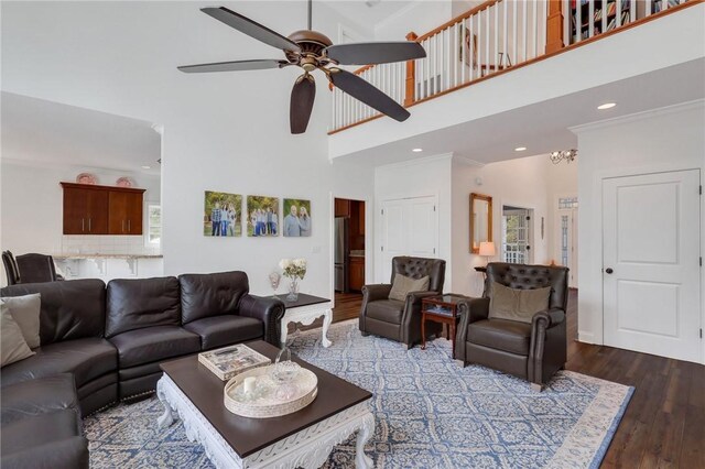 1068 Picnic Ln NE, Townsend, GA 31331 - living area with ceiling fan with notable chandelier, a towering ceiling, wood finished floors, and recessed lighting