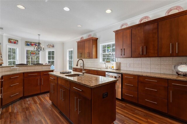 1068 Picnic Ln NE, Townsend, GA 31331 - kitchen with dishwasher, decorative backsplash, light stone counters, and a sink