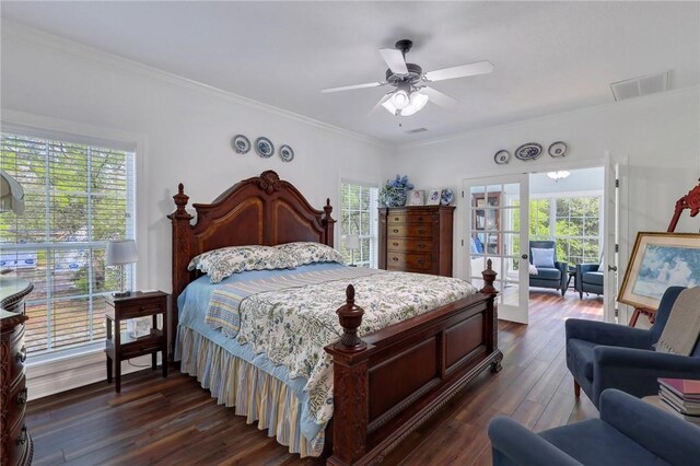 1068 Picnic Ln NE, Townsend, GA 31331 - bedroom with ceiling fan, visible vents, ornamental molding, and dark wood-style flooring