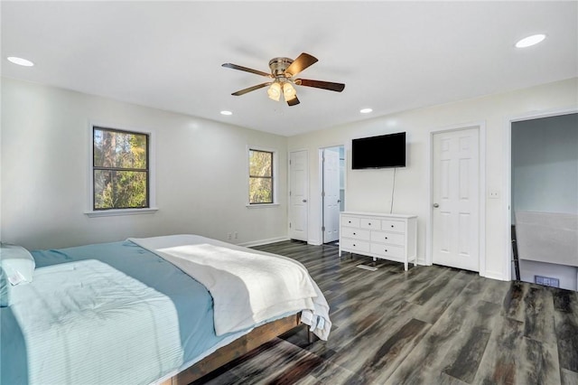 bedroom with ceiling fan and dark hardwood / wood-style flooring