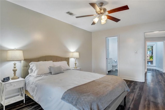 bedroom featuring ceiling fan, ensuite bath, and dark hardwood / wood-style floors