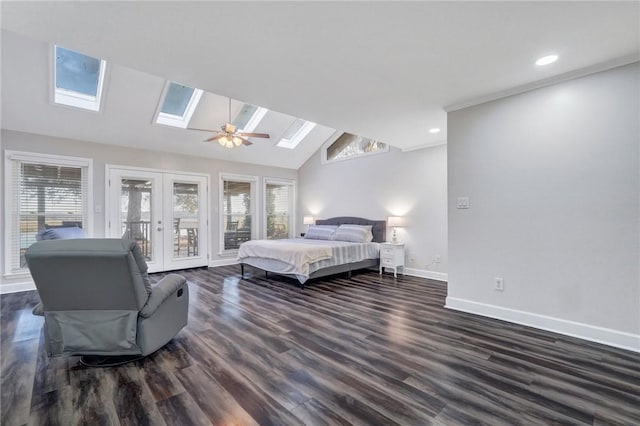 bedroom featuring multiple windows, lofted ceiling with skylight, access to outside, and french doors