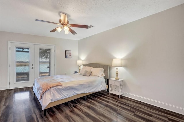 bedroom featuring french doors, a textured ceiling, dark hardwood / wood-style floors, ceiling fan, and access to exterior