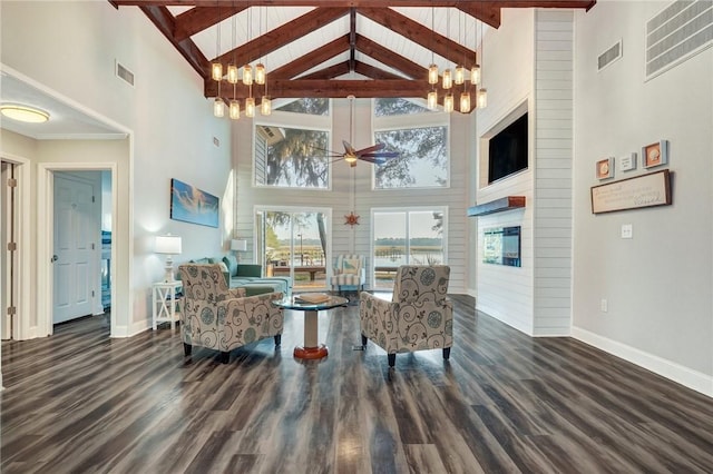 interior space with dark hardwood / wood-style flooring, high vaulted ceiling, and beamed ceiling