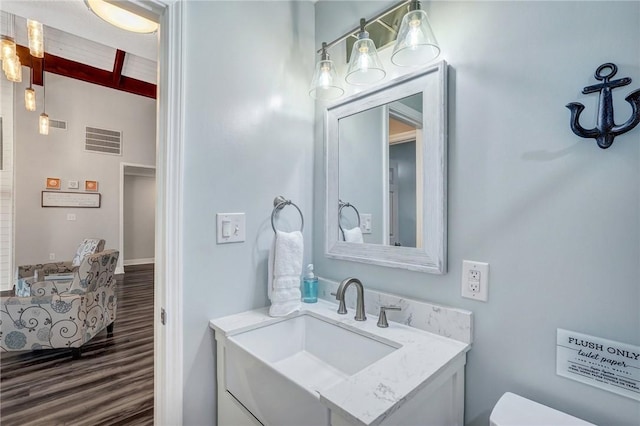 bathroom featuring hardwood / wood-style flooring and vanity