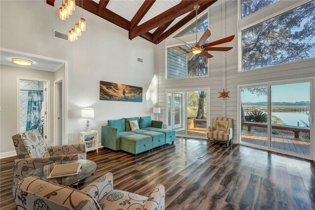 living room with a water view, high vaulted ceiling, dark hardwood / wood-style floors, beamed ceiling, and ceiling fan