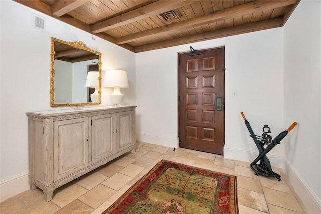 foyer with beam ceiling and wood ceiling