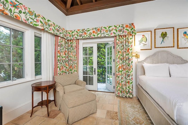 bedroom featuring access to exterior, french doors, and multiple windows