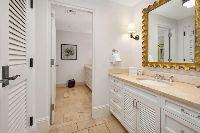 600 Beach Club Dr Unit 623/624, Sea Island, GA 31561 - bathroom featuring vanity and stone finish floors