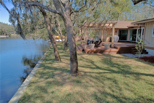105 Driftwood Pl, Saint Simons Island, GA 31522 - view of green lawn with a pergola, a deck with water view, and outdoor lounge area