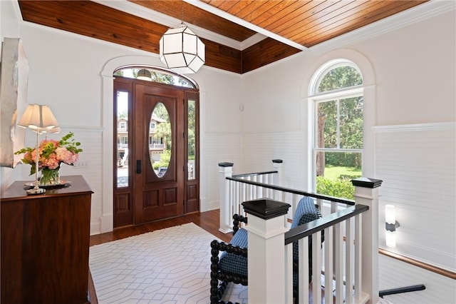 50 Frederica Oaks Ln, Saint Simons Island, GA 31522 - entryway featuring wood ceiling with exposed beams, wainscoting, and wood finished floors
