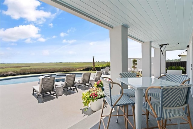 50 Frederica Oaks Ln, Saint Simons Island, GA 31522 - view of patio featuring an outdoor pool and outdoor dining area