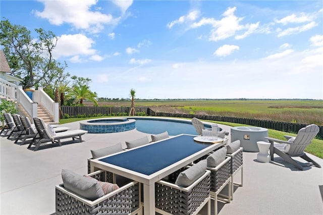 50 Frederica Oaks Ln, Saint Simons Island, GA 31522 - view of pool with a patio, a fire pit, outdoor dining area, stairs, and a pool with connected hot tub