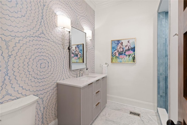 50 Frederica Oaks Ln, Saint Simons Island, GA 31522 - full bathroom featuring baseboards, wallpapered walls, toilet, vanity, and marble look tile flooring