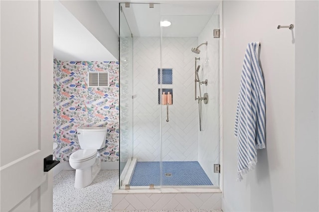 50 Frederica Oaks Ln, Saint Simons Island, GA 31522 - full bath featuring toilet, a shower stall, and speckle patterned floor
