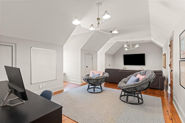 50 Frederica Oaks Ln, Saint Simons Island, GA 31522 - interior space with vaulted ceiling, wood finished floors, a chandelier, and baseboards