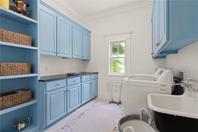 50 Frederica Oaks Ln, Saint Simons Island, GA 31522 - washroom featuring cabinet space, separate washer and dryer, ornamental molding, and baseboards