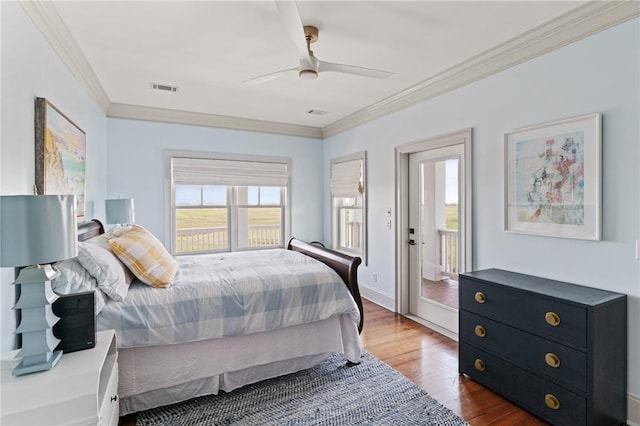 50 Frederica Oaks Ln, Saint Simons Island, GA 31522 - bedroom featuring ornamental molding, dark wood-style flooring, and a ceiling fan
