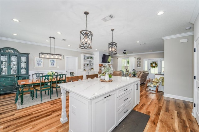 121 Farms Edge Rd S, Manor, GA 31550 - kitchen with white cabinetry, recessed lighting, a center island, a ceiling fan, and open floor plan