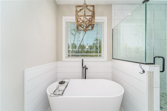 121 Farms Edge Rd S, Manor, GA 31550 - bathroom featuring a chandelier, a freestanding bath, and a stall shower