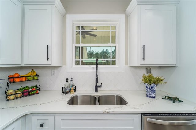 121 Farms Edge Rd S, Manor, GA 31550 - kitchen featuring stainless steel dishwasher, white cabinetry, decorative backsplash, and light stone countertops