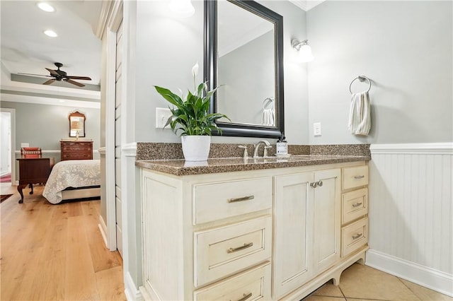 111 Palm Dr, Saint Simons Island, GA 31522 - ensuite bathroom with vanity, a wainscoted wall, ceiling fan, recessed lighting, and ornamental molding