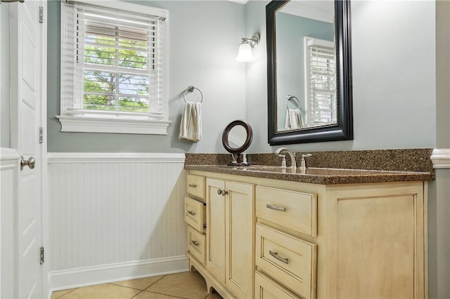 111 Palm Dr, Saint Simons Island, GA 31522 - bathroom with wainscoting, vanity, and tile patterned flooring