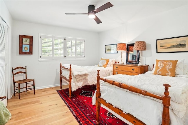 111 Palm Dr, Saint Simons Island, GA 31522 - bedroom with wood finished floors, a closet, and ceiling fan