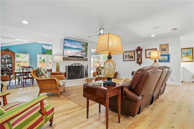 111 Palm Dr, Saint Simons Island, GA 31522 - living area featuring a brick fireplace, light wood-type flooring, crown molding, and recessed lighting