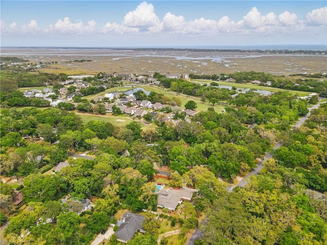 111 Palm Dr, Saint Simons Island, GA 31522 - aerial overview of property's location featuring a large body of water and nearby suburban area