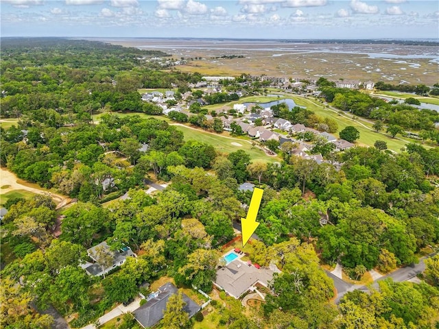111 Palm Dr, Saint Simons Island, GA 31522 - aerial overview of property's location featuring a large body of water, a golf course, and nearby suburban area