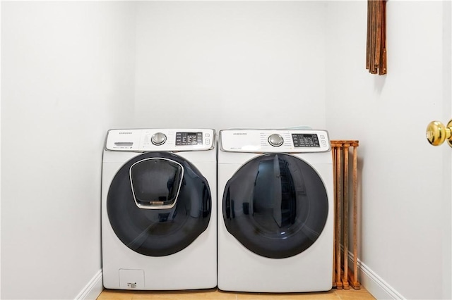 111 Palm Dr, Saint Simons Island, GA 31522 - washroom with separate washer and dryer and baseboards