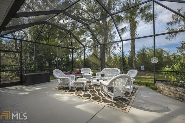 view of patio / terrace featuring a lanai