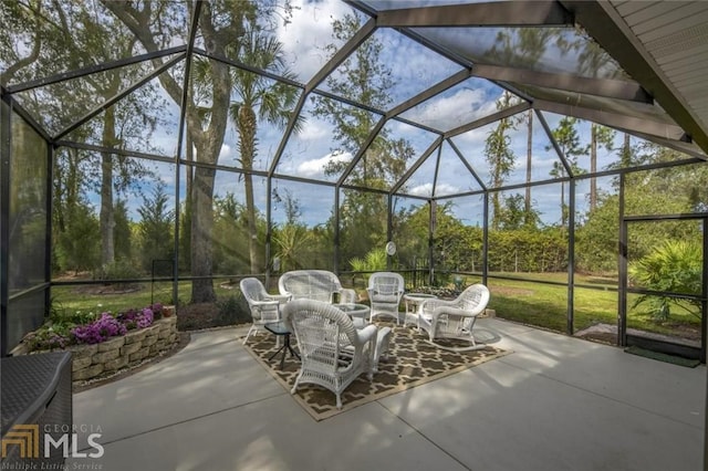 view of patio / terrace featuring glass enclosure