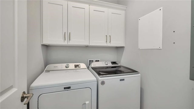 laundry room featuring cabinet space and washing machine and clothes dryer