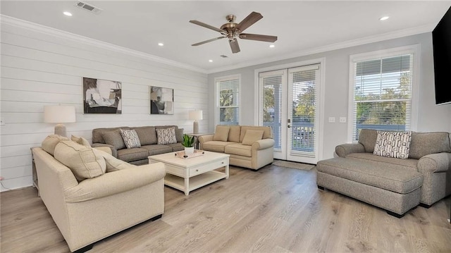 living area featuring visible vents, a ceiling fan, crown molding, light wood-type flooring, and recessed lighting