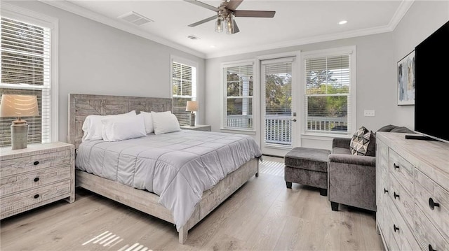 bedroom featuring ornamental molding, light wood-style floors, visible vents, and access to exterior