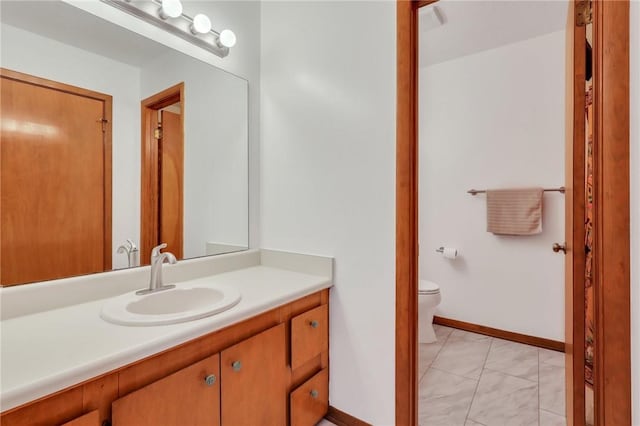 bathroom with vanity and toilet