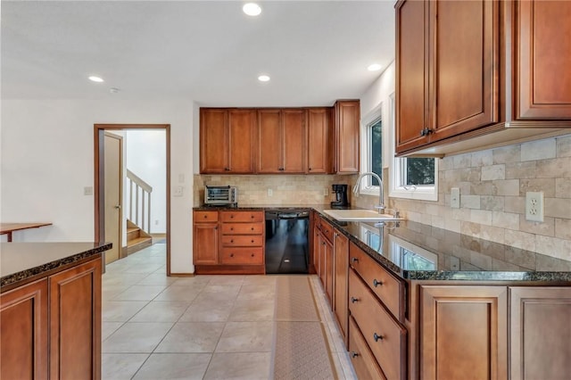 kitchen with dark stone counters, sink, light tile patterned floors, black dishwasher, and tasteful backsplash