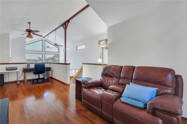 living room with ceiling fan, dark hardwood / wood-style flooring, and high vaulted ceiling